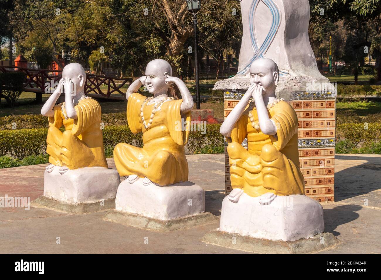 Three Statu in Mahatma Gandhi`s Three Monkeys position, covering his eyes, who sees no evil; Kikazaru, covering his ears, who hears no evil; and Iwaza Stock Photo